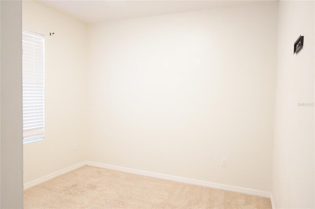 9016 Pyrus St, Kissimmee, FL 34747 - spare room featuring light colored carpet and baseboards