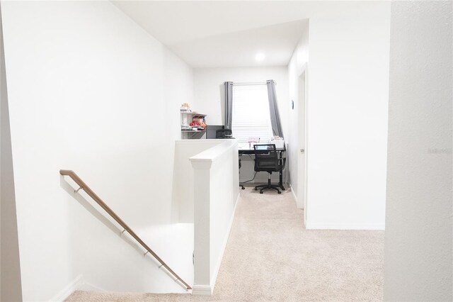 9016 Pyrus St, Kissimmee, FL 34747 - hall featuring an upstairs landing, light carpet, and baseboards
