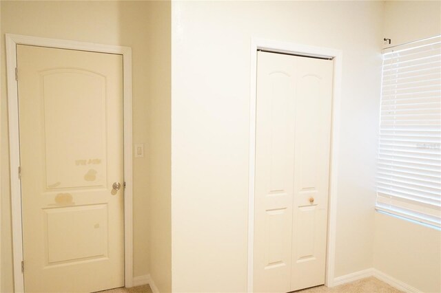 9016 Pyrus St, Kissimmee, FL 34747 - hallway featuring baseboards and light carpet