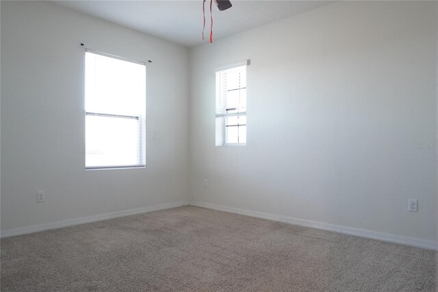 9016 Pyrus St, Kissimmee, FL 34747 - spare room featuring light colored carpet and baseboards