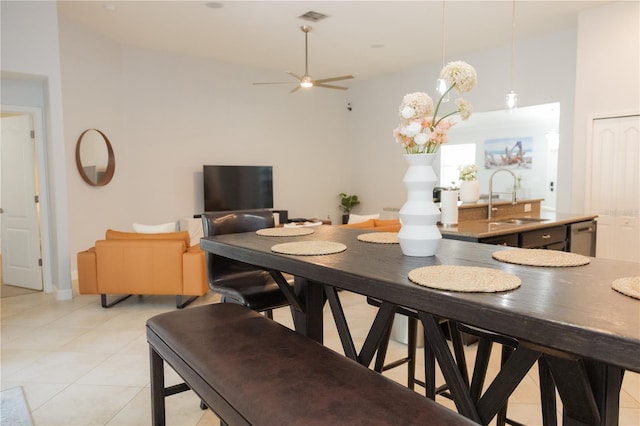 dining room with a ceiling fan, visible vents, and light tile patterned floors