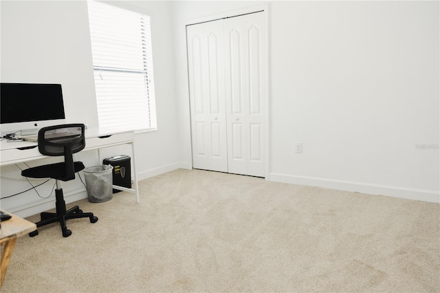 carpeted office with baseboards
