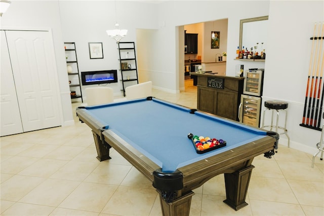 rec room with baseboards, pool table, a chandelier, and light tile patterned floors