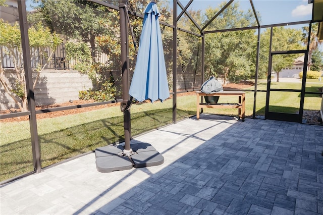 view of patio / terrace featuring a lanai