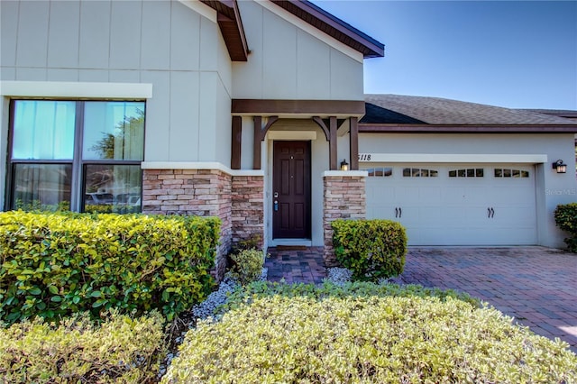 5118 Tiber Way, Saint Cloud, FL 34771 - view of front facade featuring board and batten siding, driveway, roof with shingles, and a garage