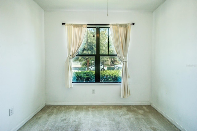 5118 Tiber Way, Saint Cloud, FL 34771 - empty room featuring plenty of natural light, baseboards, and carpet