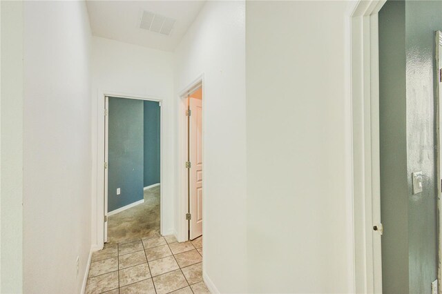 5118 Tiber Way, Saint Cloud, FL 34771 - corridor with light tile patterned flooring, visible vents, and baseboards
