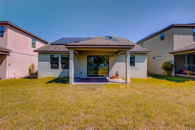 5118 Tiber Way, Saint Cloud, FL 34771 - back of property featuring a lawn, roof with shingles, a patio area, and stucco siding