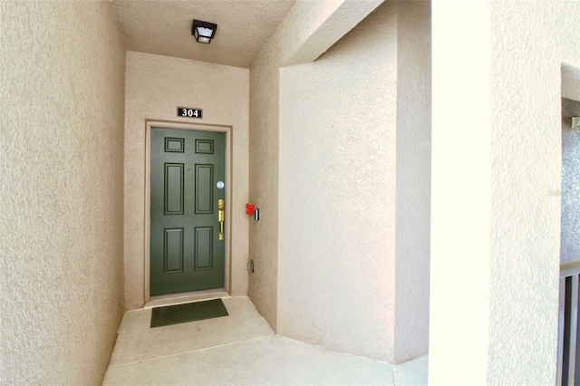 9435 Myrtle Creek Ln Unit 304, Orlando, FL 32832 - doorway to property featuring stucco siding