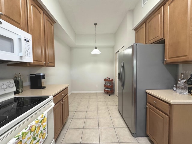 9435 Myrtle Creek Ln Unit 304, Orlando, FL 32832 - kitchen featuring brown cabinets, white appliances, and light countertops