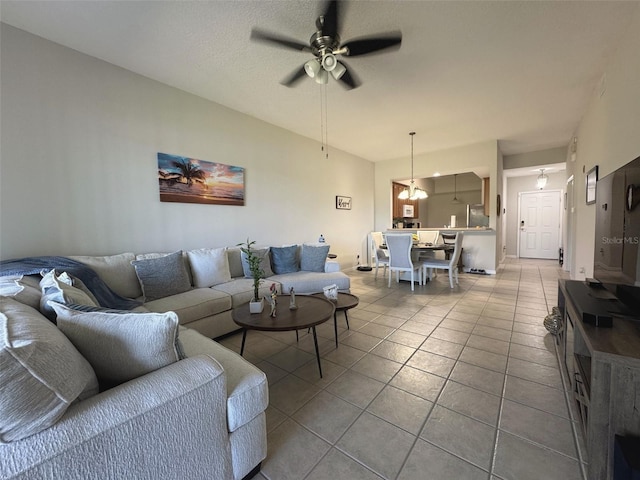 9435 Myrtle Creek Ln Unit 304, Orlando, FL 32832 - living area with tile patterned flooring and ceiling fan with notable chandelier