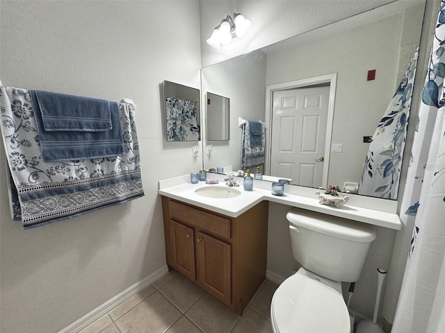 9435 Myrtle Creek Ln Unit 304, Orlando, FL 32832 - bathroom with vanity, tile patterned floors, baseboards, and toilet