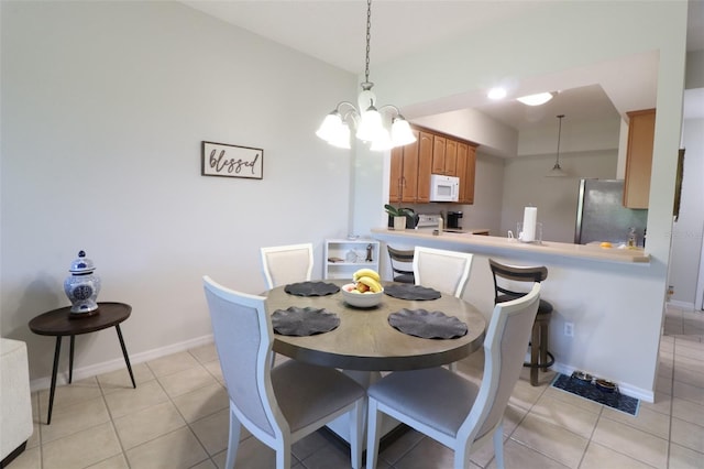 9435 Myrtle Creek Ln Unit 304, Orlando, FL 32832 - dining area with baseboards and light tile patterned floors