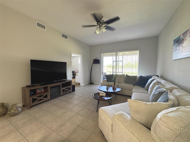 9435 Myrtle Creek Ln Unit 304, Orlando, FL 32832 - living area with ceiling fan, visible vents, a textured ceiling, and light tile patterned floors