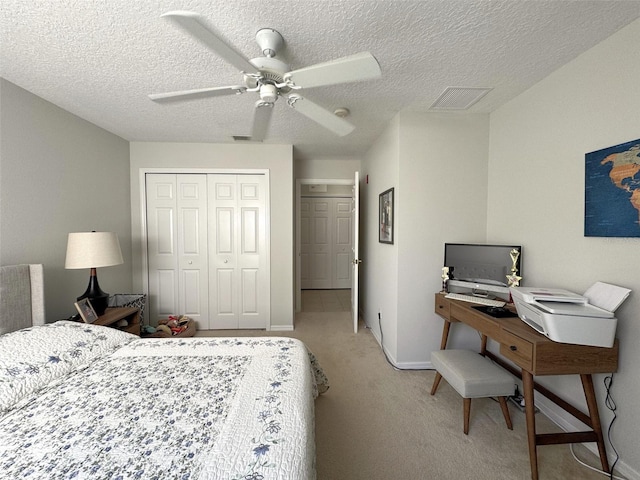 9435 Myrtle Creek Ln Unit 304, Orlando, FL 32832 - bedroom featuring visible vents, a closet, a textured ceiling, light colored carpet, and ceiling fan