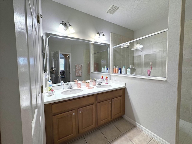 9435 Myrtle Creek Ln Unit 304, Orlando, FL 32832 - full bathroom with tile patterned flooring, visible vents, a sink, and tiled shower