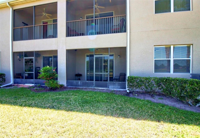 9435 Myrtle Creek Ln Unit 304, Orlando, FL 32832 - rear view of house featuring stucco siding, a sunroom, and ceiling fan