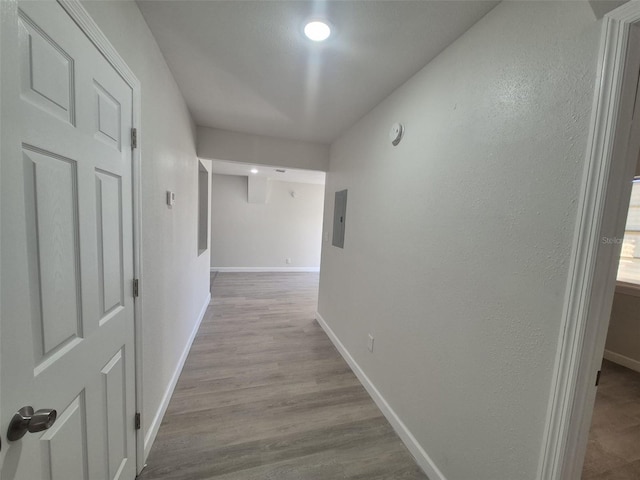 139 Arroyo Pkwy, Ormond Beach, FL 32174 - hall with recessed lighting, wood finished floors, electric panel, and baseboards