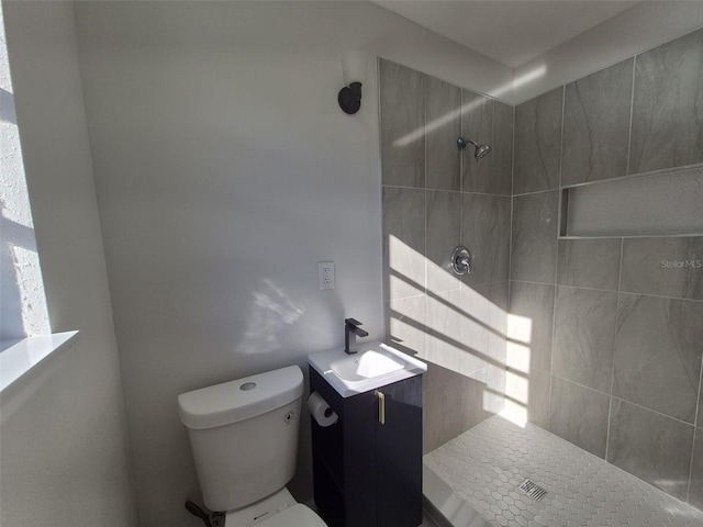 139 Arroyo Pkwy, Ormond Beach, FL 32174 - bathroom with toilet, vanity, and a tile shower