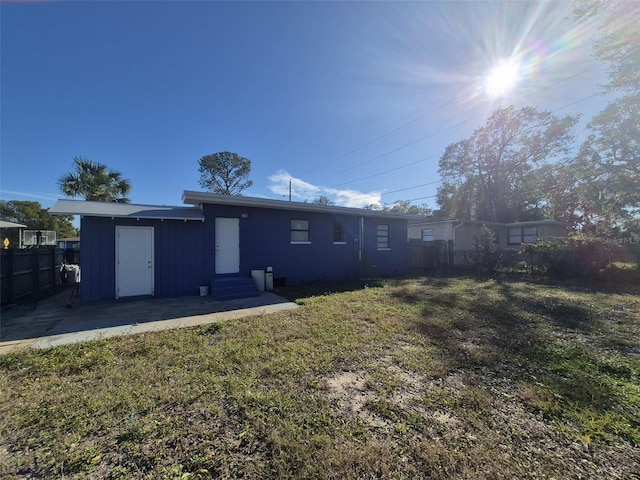 139 Arroyo Pkwy, Ormond Beach, FL 32174 - back of property with a yard, fence, a patio area, and entry steps