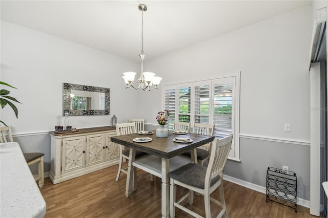 523 Shell Creek St, Poinciana, FL 34759 - dining area featuring baseboards, wood finished floors, and a notable chandelier