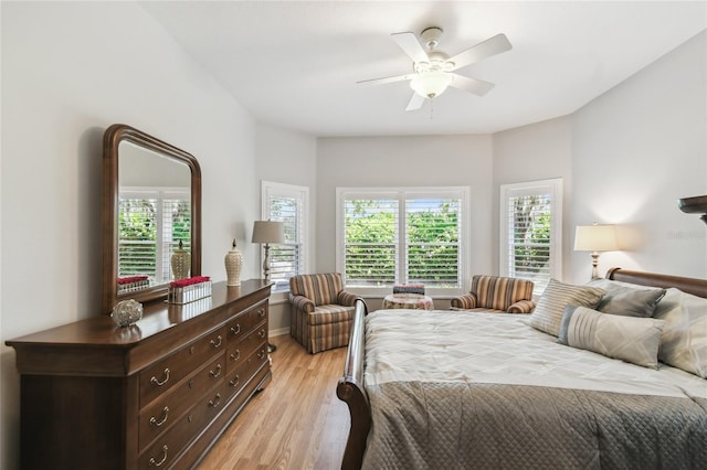 523 Shell Creek St, Poinciana, FL 34759 - bedroom featuring a ceiling fan, baseboards, light wood-style floors, and multiple windows