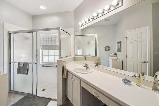 523 Shell Creek St, Poinciana, FL 34759 - full bathroom with a shower stall, tile patterned floors, and vanity