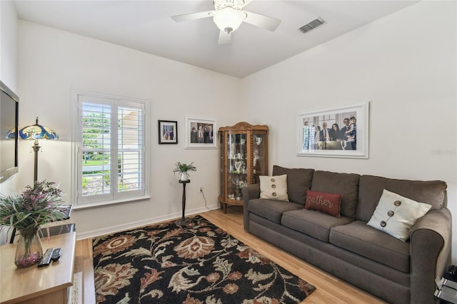 523 Shell Creek St, Poinciana, FL 34759 - living room featuring visible vents, baseboards, wood finished floors, and ceiling fan