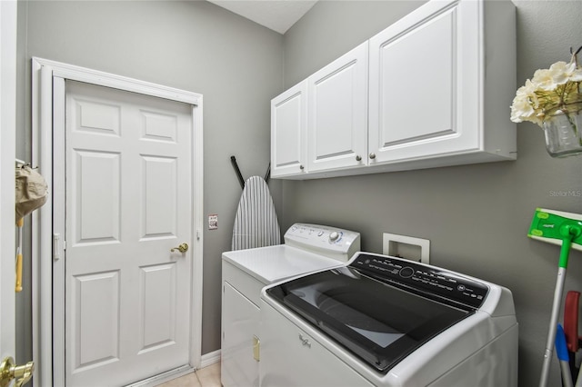 523 Shell Creek St, Poinciana, FL 34759 - clothes washing area with washing machine and clothes dryer and cabinet space