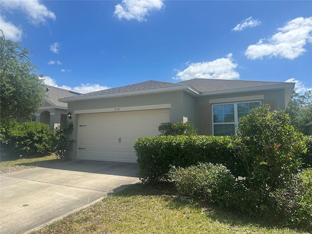 view of property exterior featuring stucco siding, an attached garage, and concrete driveway