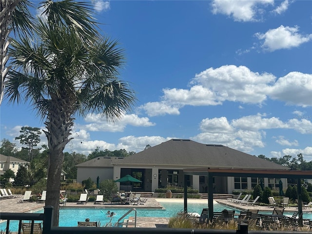 community pool featuring a patio area