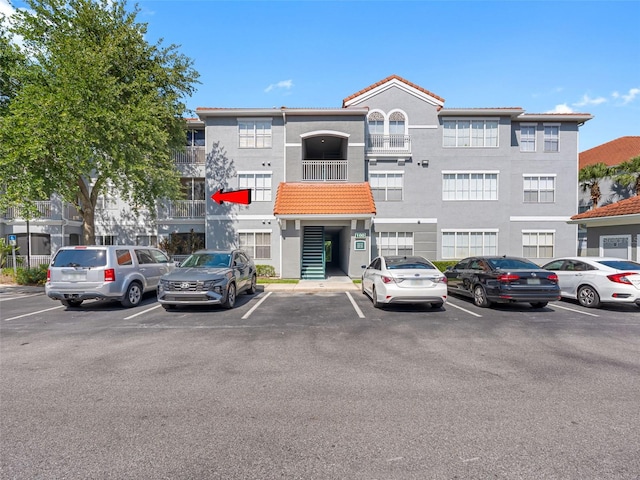 18001 Richmond Place Dr Unit 126, Tampa, FL 33647 - view of building exterior with uncovered parking