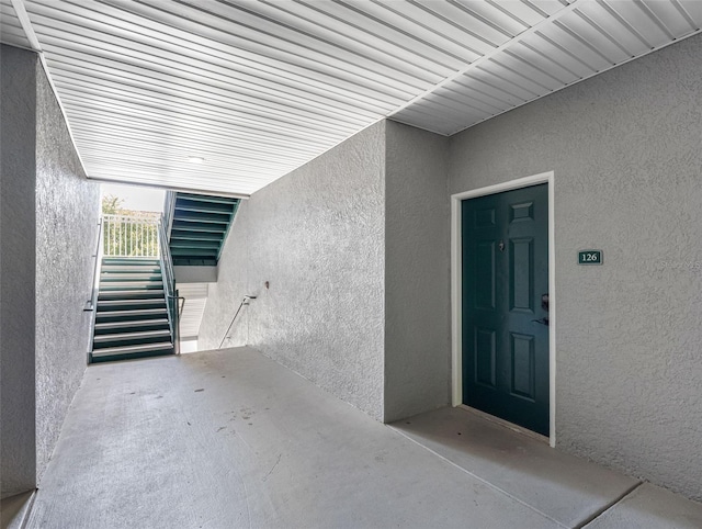 18001 Richmond Place Dr Unit 126, Tampa, FL 33647 - view of exterior entry featuring stucco siding and a patio area