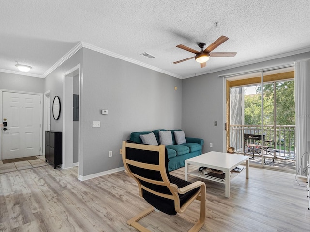 18001 Richmond Place Dr Unit 126, Tampa, FL 33647 - living room featuring a textured ceiling, ceiling fan, light wood-style floors, and crown molding