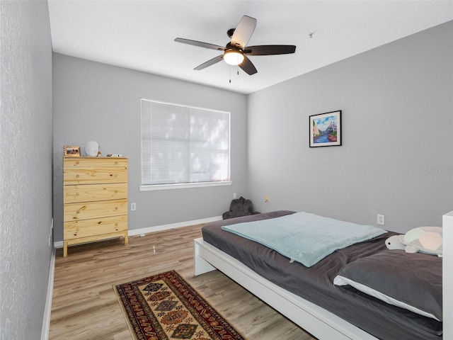 18001 Richmond Place Dr Unit 126, Tampa, FL 33647 - bedroom with wood finished floors and ceiling fan