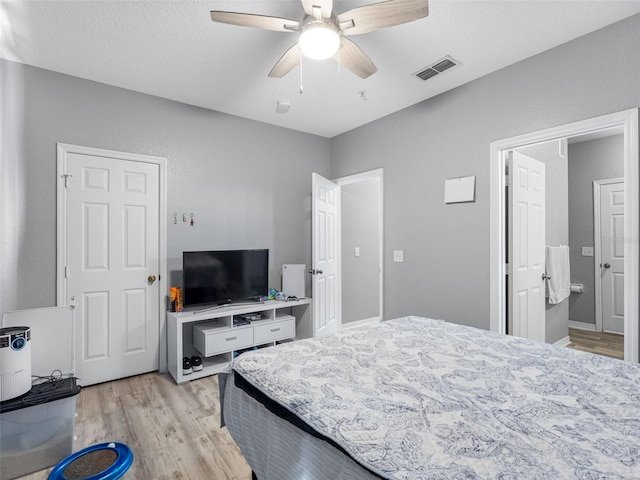 18001 Richmond Place Dr Unit 126, Tampa, FL 33647 - bedroom featuring light wood-type flooring and ceiling fan