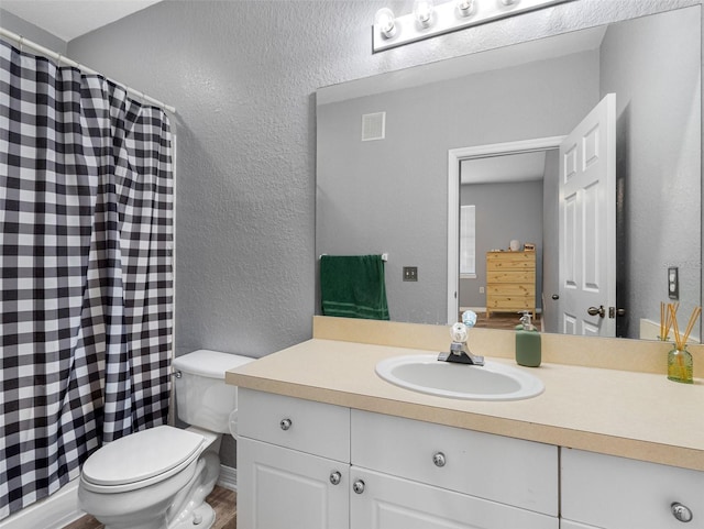 18001 Richmond Place Dr Unit 126, Tampa, FL 33647 - full bath with vanity, a textured wall, and a shower with curtain