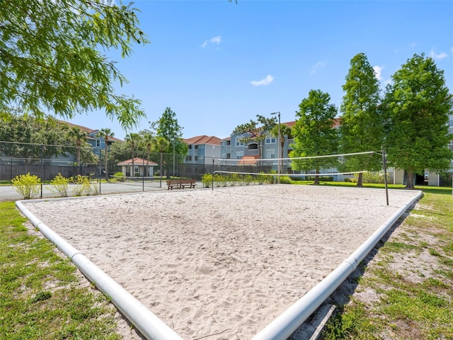 18001 Richmond Place Dr Unit 126, Tampa, FL 33647 - surrounding community with volleyball court and a residential view