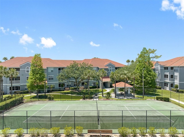 18001 Richmond Place Dr Unit 126, Tampa, FL 33647 - view of tennis court featuring a gazebo and a residential view