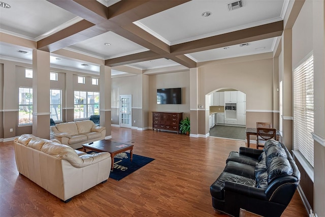 18001 Richmond Place Dr Unit 126, Tampa, FL 33647 - living area with arched walkways, beam ceiling, coffered ceiling, wood finished floors, and ornamental molding