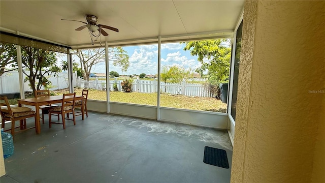 954 Hacienda Cir, Kissimmee, FL 34741 - sunroom / solarium featuring a ceiling fan and outdoor dining area