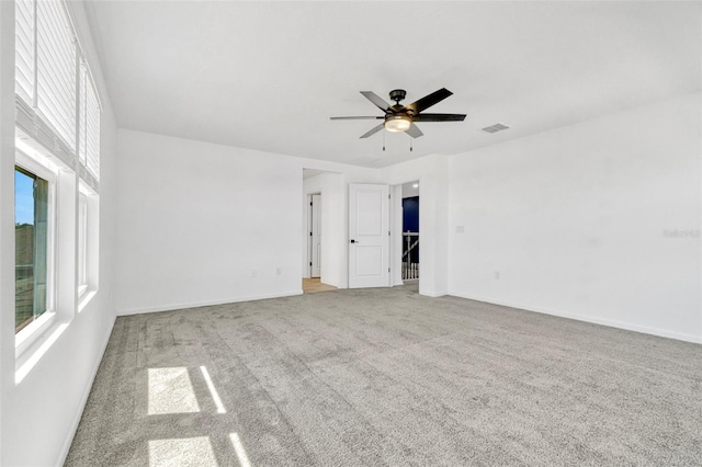1003 Sugarwood St, Davenport, FL 33837 - spare room with carpet floors, visible vents, a ceiling fan, and baseboards