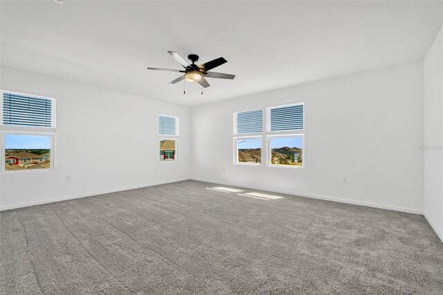 1003 Sugarwood St, Davenport, FL 33837 - unfurnished room with ceiling fan, carpet floors, and baseboards