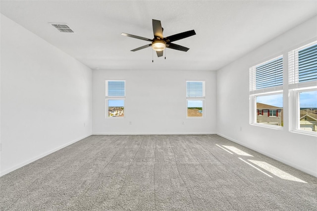 1003 Sugarwood St, Davenport, FL 33837 - spare room with ceiling fan, baseboards, visible vents, and carpet