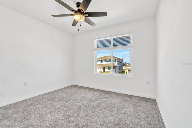 1003 Sugarwood St, Davenport, FL 33837 - carpeted empty room featuring ceiling fan and baseboards