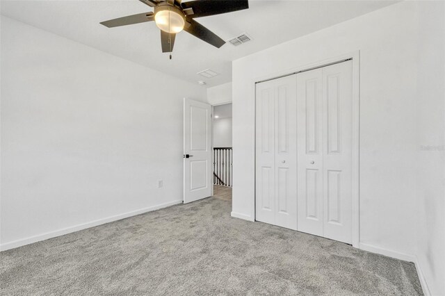 1003 Sugarwood St, Davenport, FL 33837 - unfurnished bedroom featuring visible vents, carpet floors, a closet, baseboards, and ceiling fan