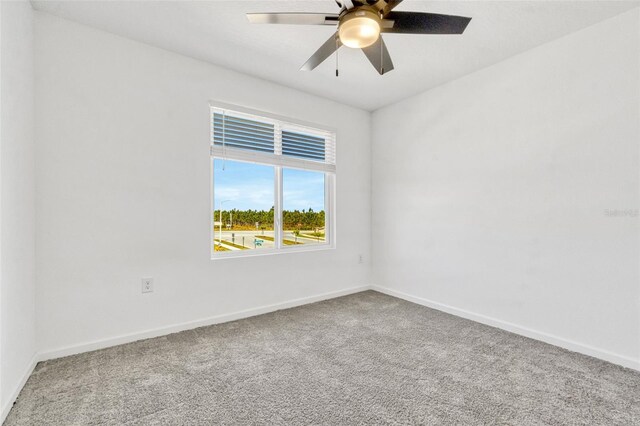 1003 Sugarwood St, Davenport, FL 33837 - carpeted spare room featuring ceiling fan and baseboards