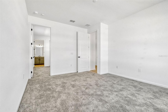 1003 Sugarwood St, Davenport, FL 33837 - unfurnished bedroom with visible vents, carpet flooring, and baseboards