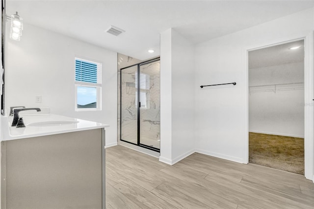 1003 Sugarwood St, Davenport, FL 33837 - bathroom with a walk in closet, visible vents, baseboards, and a marble finish shower