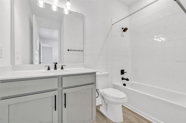 1003 Sugarwood St, Davenport, FL 33837 - full bathroom featuring toilet, wood finished floors, vanity, and tub / shower combination